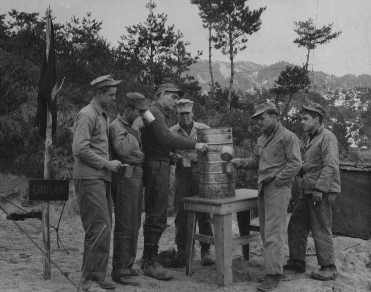 Lt. Frederick J Forney (CHC) passing out coffee in North Korea