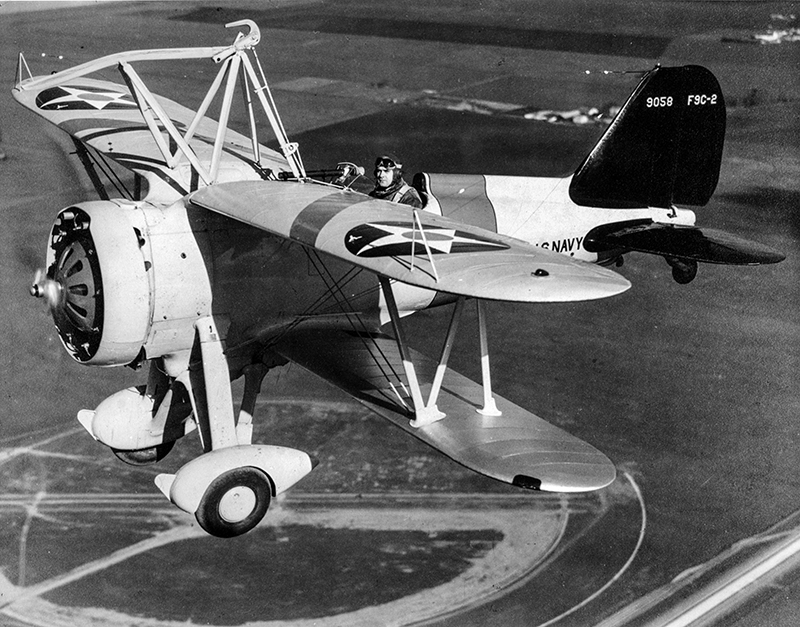 Lieutenant Harold B. "Min" miller at the controls of his F9C over Moffett Field. In 1934, Miller became the HTA Unit's Senior Aviator and was co-developer of the radio equipment which "homed" the pilots back to the airship. 