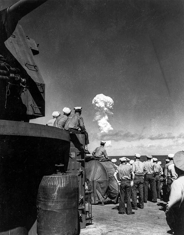 Sailors watch the mushroom cloud from the Able tests during Operation Crossroads