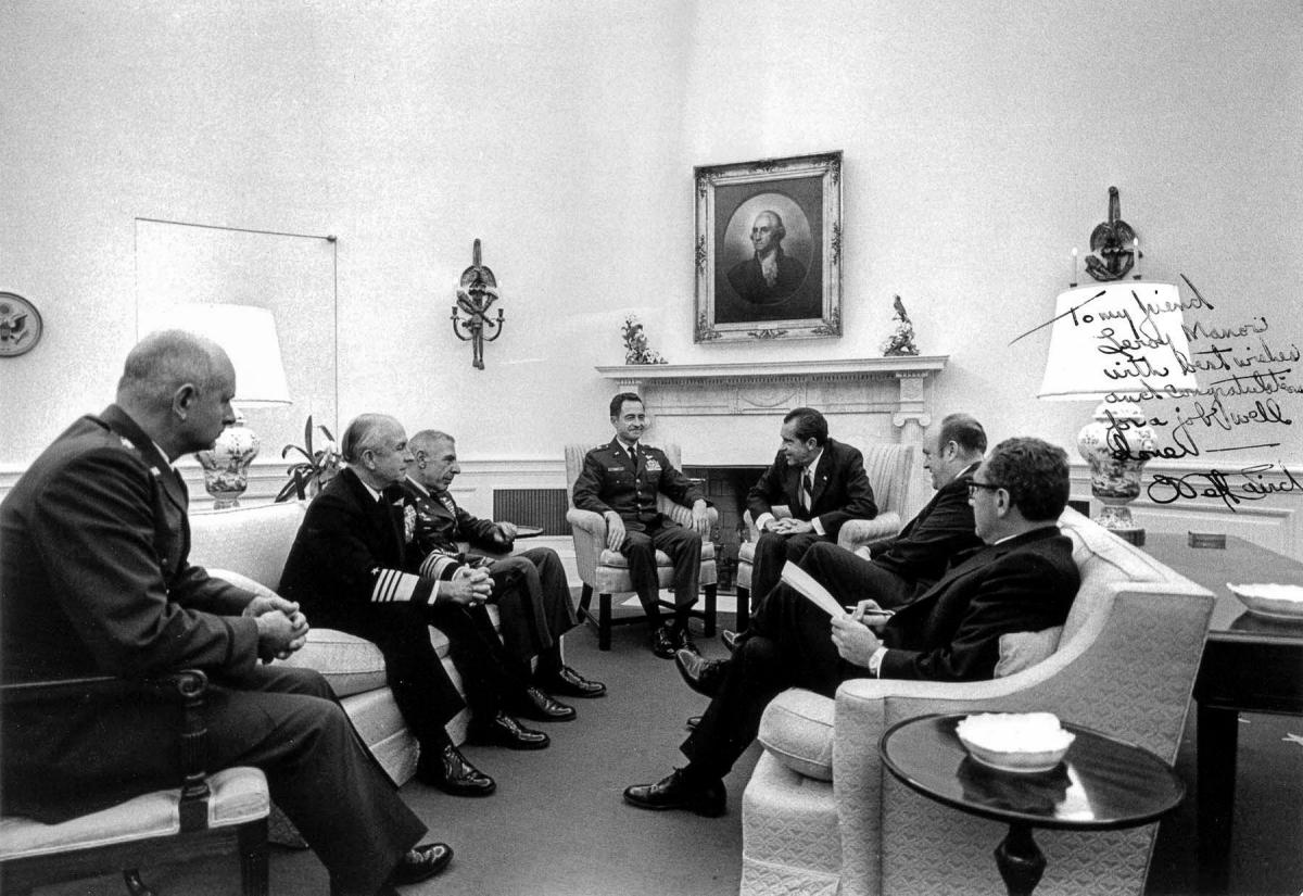 President Nixon meets with military leaders in the Oval Office to discuss results of the raid on Son Tay Prison camp in North Vietnam; October 31st, 1970