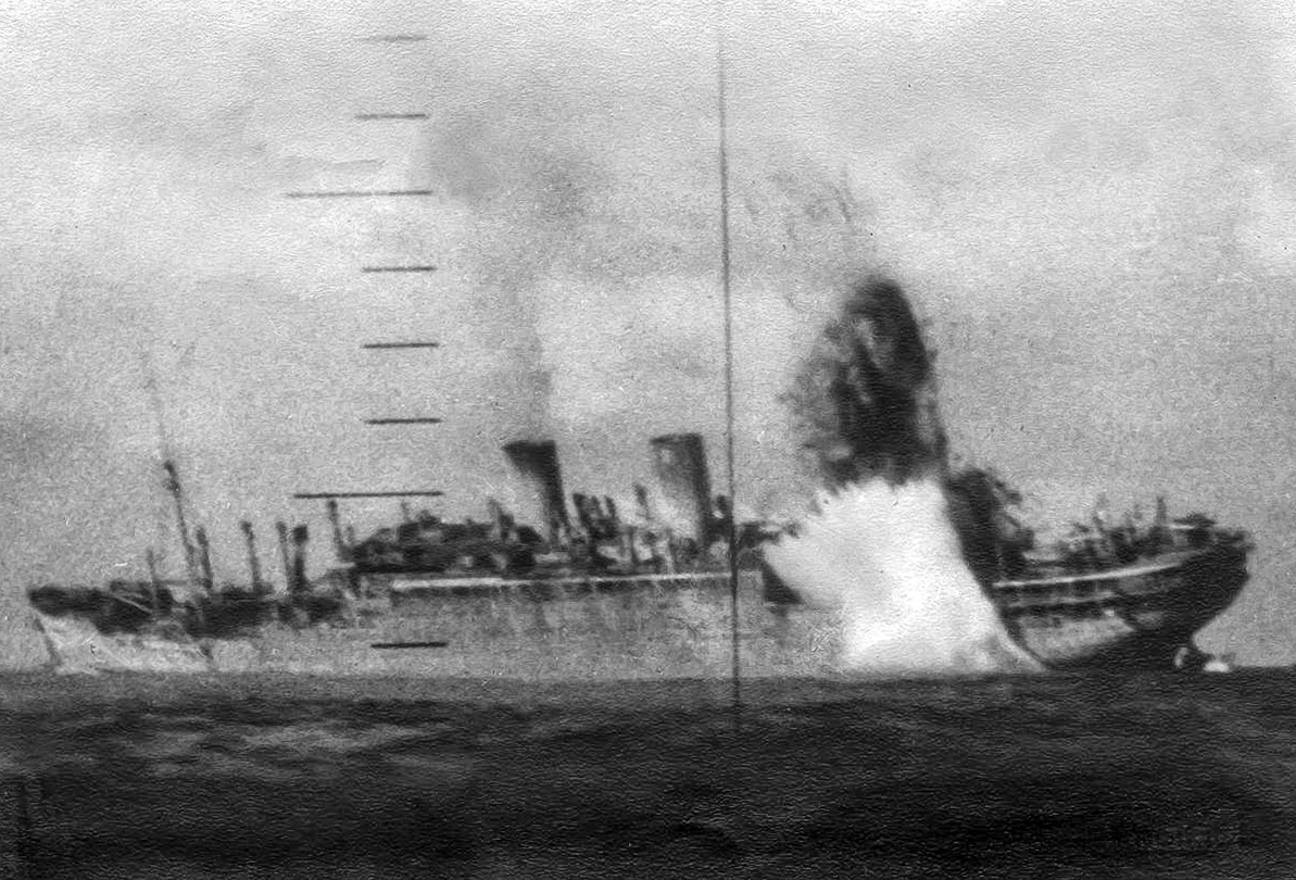 View of a Japanese ship sinking as seen through a submarine periscope.