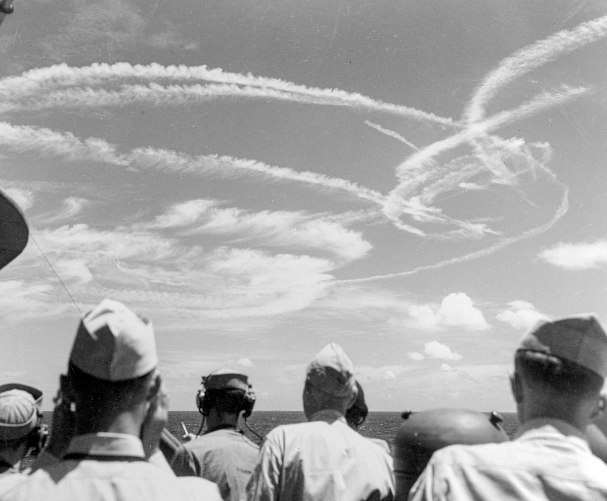 Contrails from Japanese and U.S. aircraft attract an audience from Task Force 58 during the Turkey Shoot.