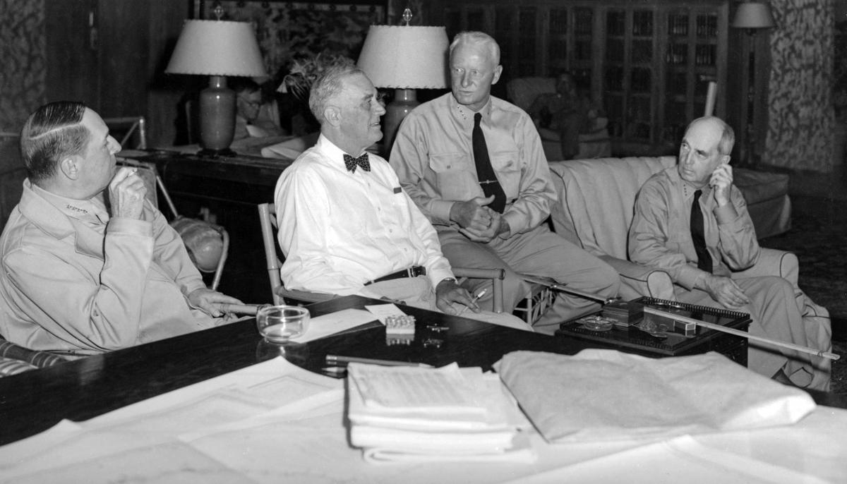 Admiral Nimitz makes his case to the President for bypassing the Philippines and invading Formosa, as General MacArthur (far left) and Chairman of the Joint Chiefs of Staff Admiral William Leahy look on