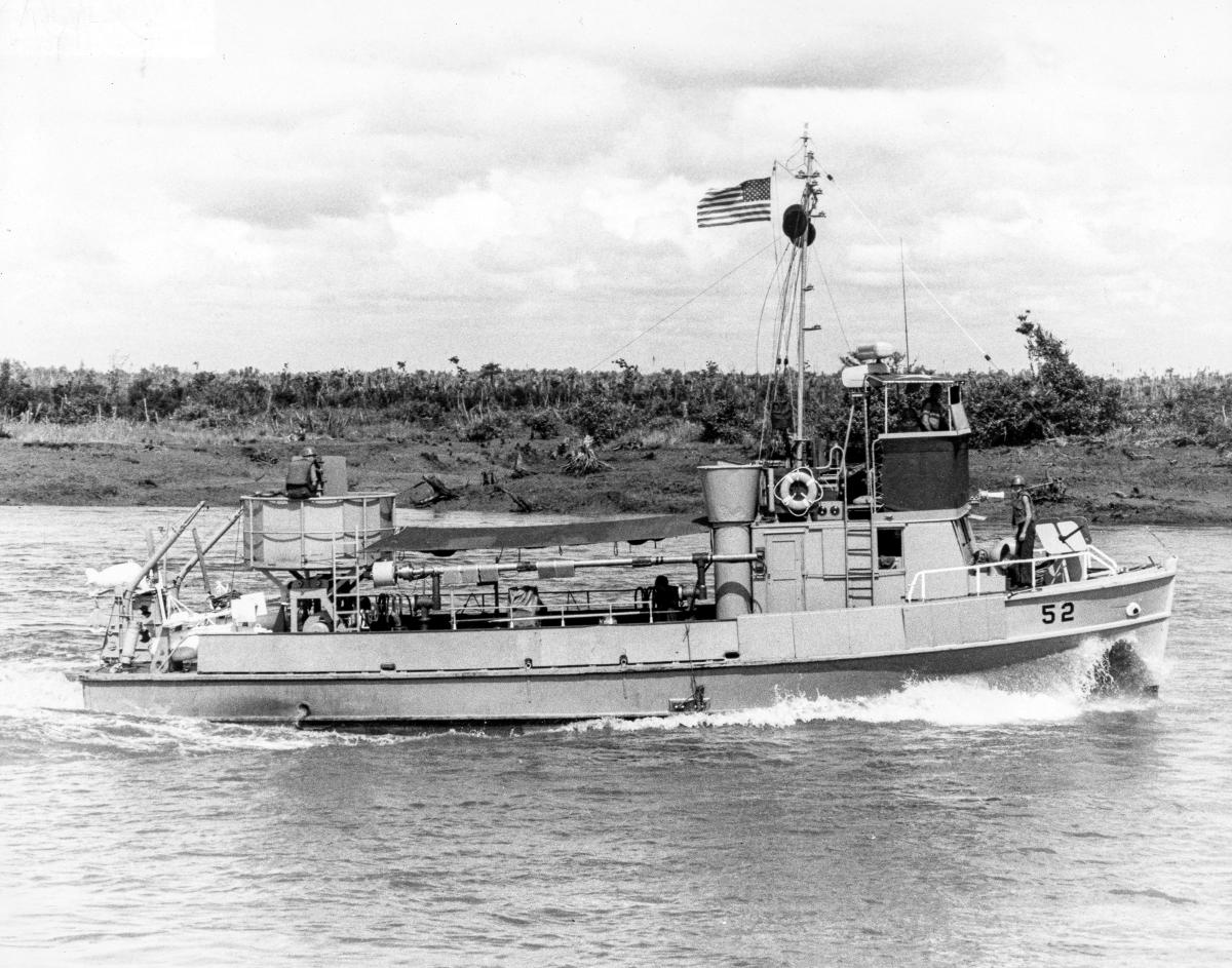 Starboard broadside view of MSB-52 chain dragging the Long Tau River.
