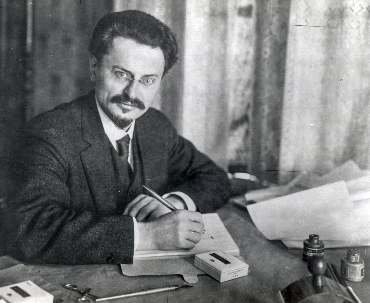 Leon Trotsky sitting at a desk
