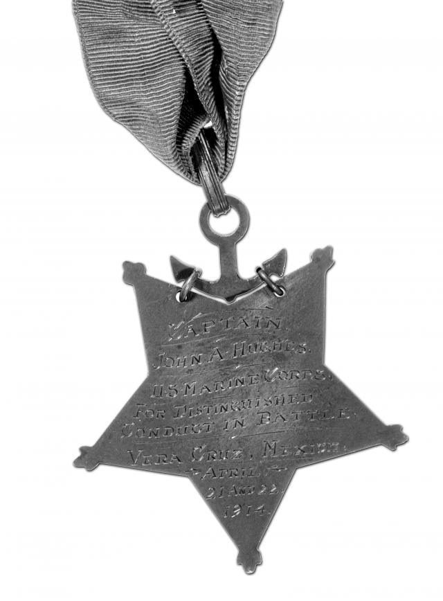 Medal of Honor awarded to “Johnny the Hard” Hughes, USMC
