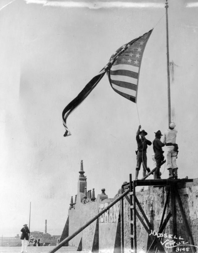Marines ultimately raising the U.S. flag over the city of Veracruz in 1914.