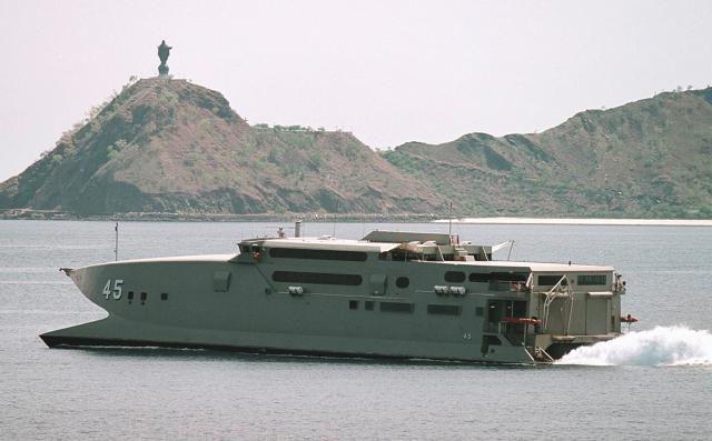 The Australian high-speed ferry HMAS Jervis Bay in Dili, East Timor. Jervis Bay was used to quickly transport troops and equipment from Darwin to East Timor during the 1999 independence crisis, often making the 900-mile return trip in less than 24 hours.