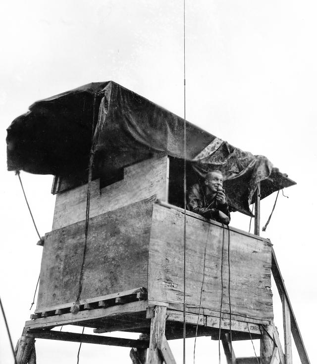 Marine Second Lieutenant Cliff Toland directs fighter operations from Yontan’s control tower.