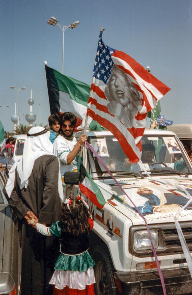 Citizens of Kuwait City celebrate their country’s liberation following the withdrawal of Iraqi troops in February 1991