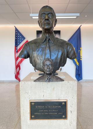 Additive manufacturing can be used for a variety of detailed production work. For example, Naval Academy Midshipmen First Class J. P. Anyansi and Rebecca Chan scanned the bust of Admiral Rickover in the background, converted the scan to a printable file, then printed a scale version.
