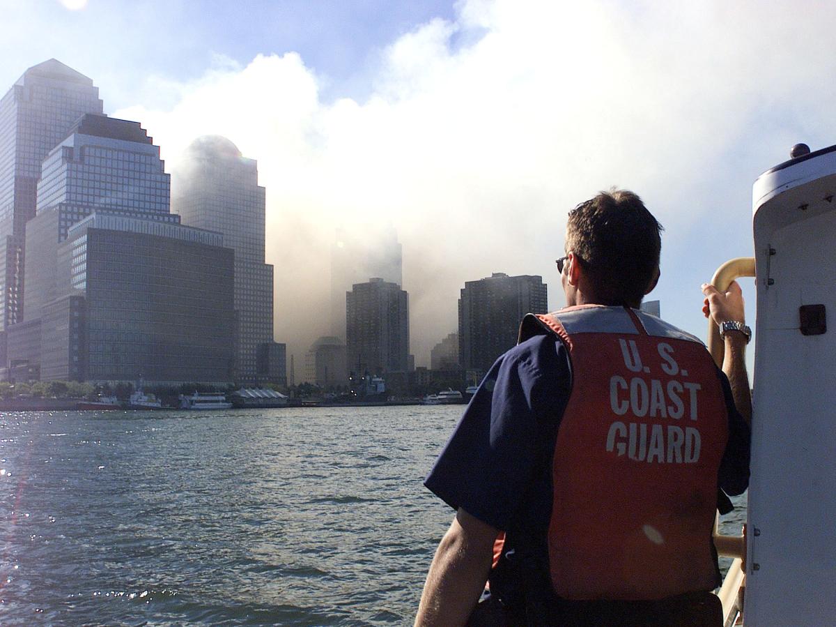 Coast Guard crew members patrol the harbor after the collapse of the World Trade Center. 