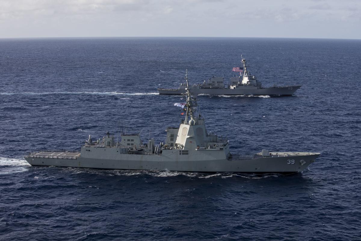 Aerial oblique starboard view of HMAS Hobart (DDG-39) sailing with the USS John Finn (DDG-113)