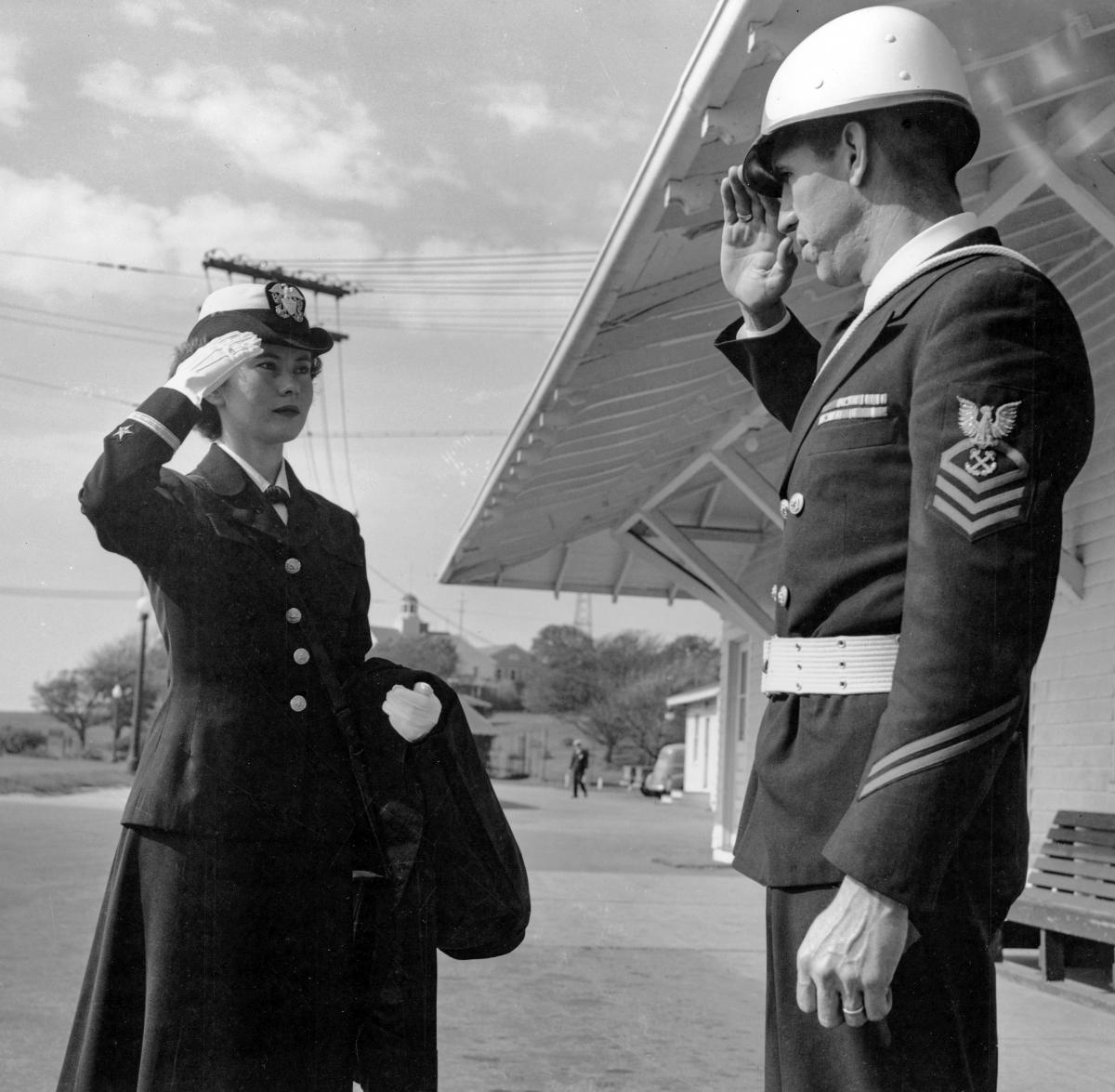 A newly minted ensign exchanges farewell salutes with a chief at OCS in Newport, Rhode Island