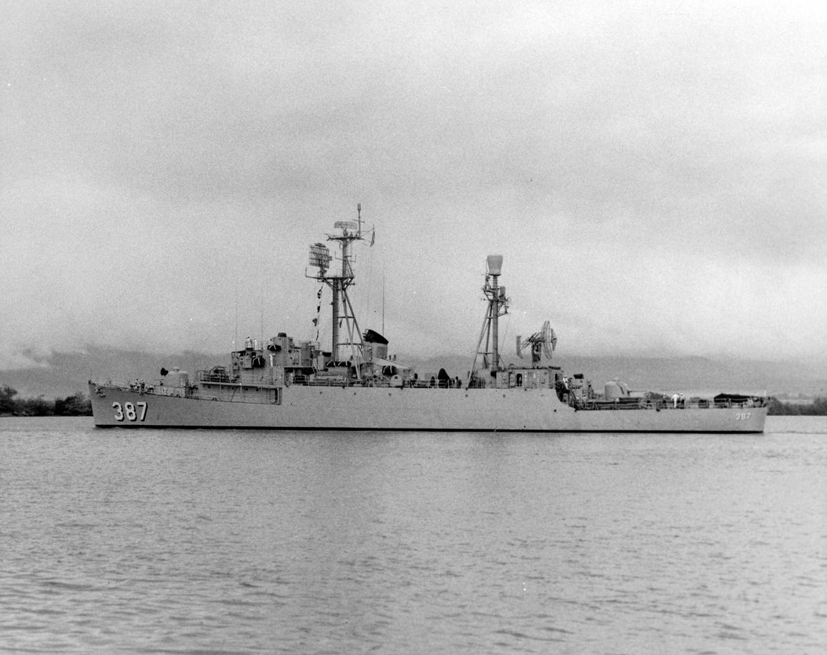 Port broadside view of the USS Vance (DER-387) entering Pearl Harbor post 1955.