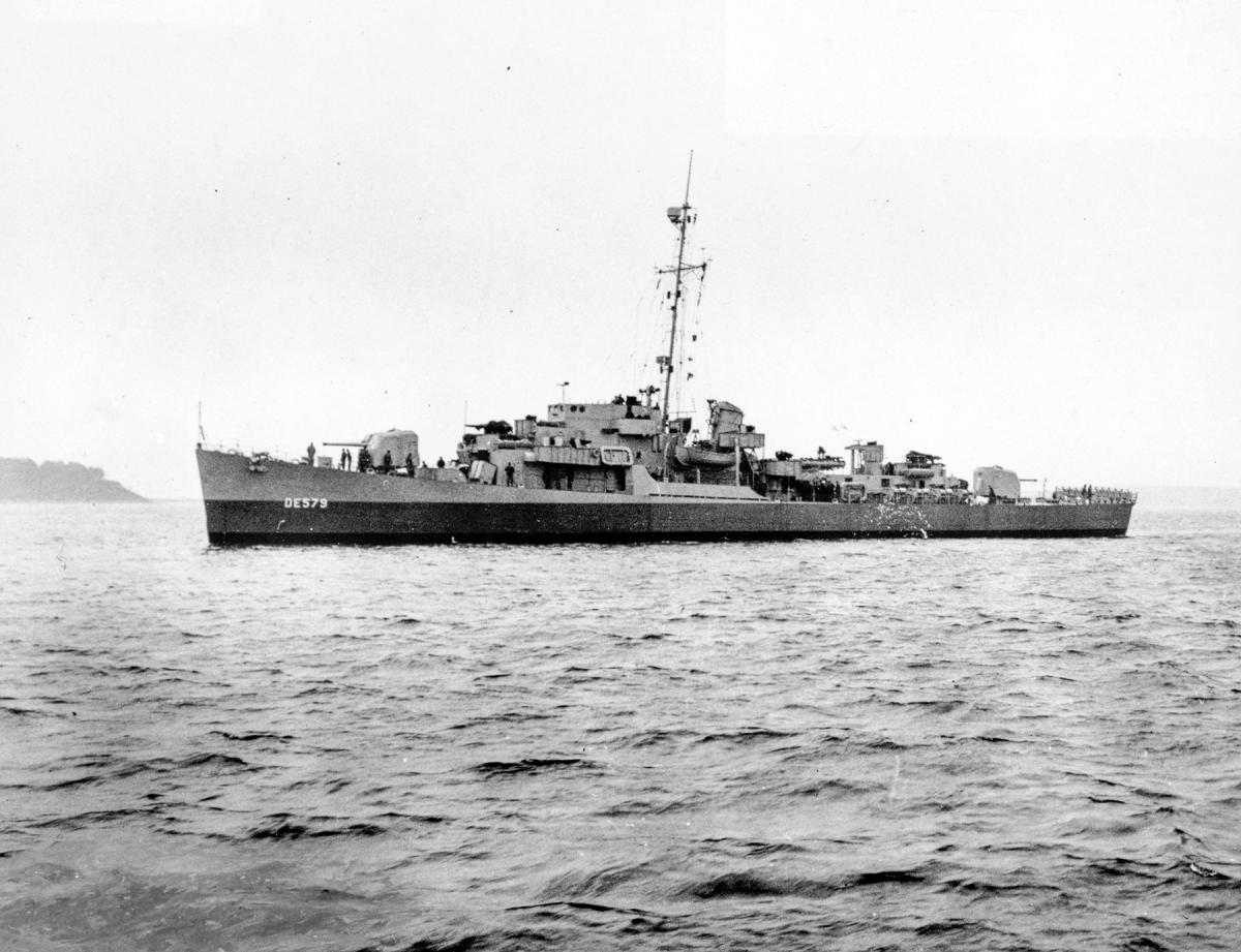 Surface port side view of the USS Riley (DE-579) at rest.