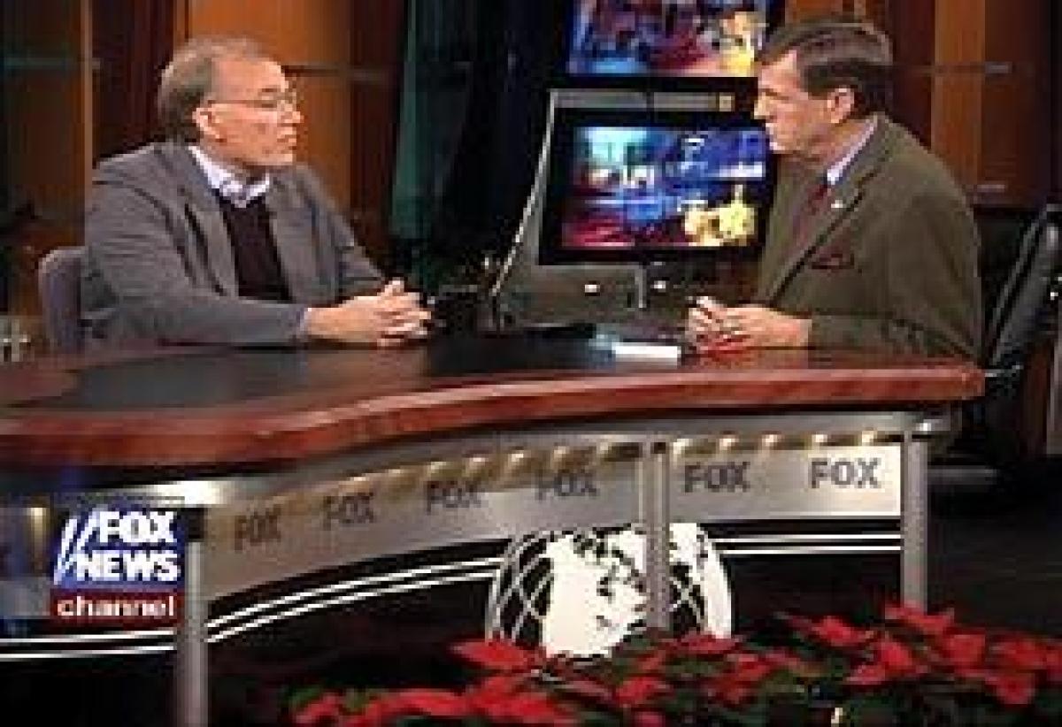 COURTESY OF THE FOX NEWS CHANNEL, "SPECIAL REPORT WITH BRIT HUME","Professor Hanson, left, appears on New Year's Day 2003 with Fox News Channel anchor Brit Hume.