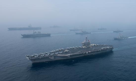 Aerial view of the Carl Vinson Carrier Strike Group and JMSDF conducting training exercises in the sea of Japan