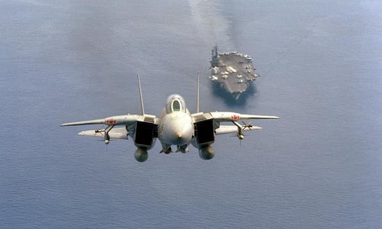 ront air-to-air view of an F-14A Tomcat aircraft from Fighter Squadron 102 (VF-102), just after taking off from the aircraft carrier USS AMERICA (CV-66)