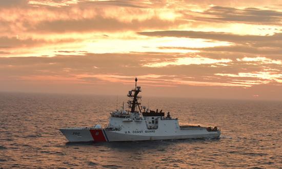 The USCGC Bertholf (WMSL-750) basks in a sunset glow in the Yellow Sea while deployed to the 7th Fleet area of responsibility in 2019.