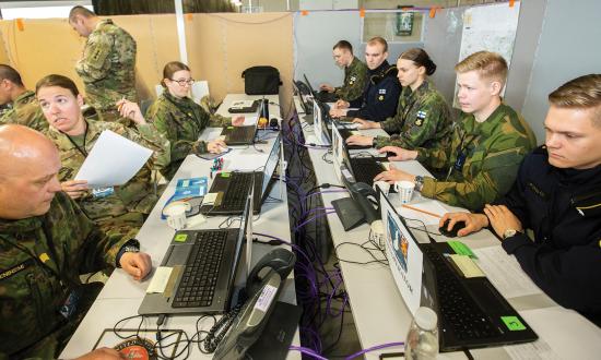 U.S. and partner nation personnel in the command-and-control hub during Bold Quest 2019 in Finland working with the Joint Staff J-6 supported Mission Partner Environment—a common language command-and-control information operating system at a security classification level releasable to all mission partners.