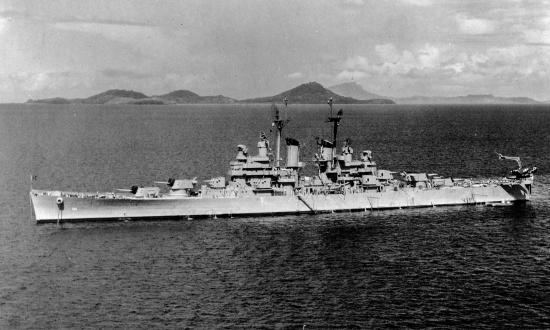 A broadside view of the light cruiser USS Atlanta (CL-104) at anchor.