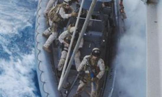 In its preparation for hunting pirates, the author's platoon trains for hook-and-climb tactics, having just completed the hook and starting to climb. At press time, the unit was en route to its first live mission. Marine Force Reconnaissance was reactivat