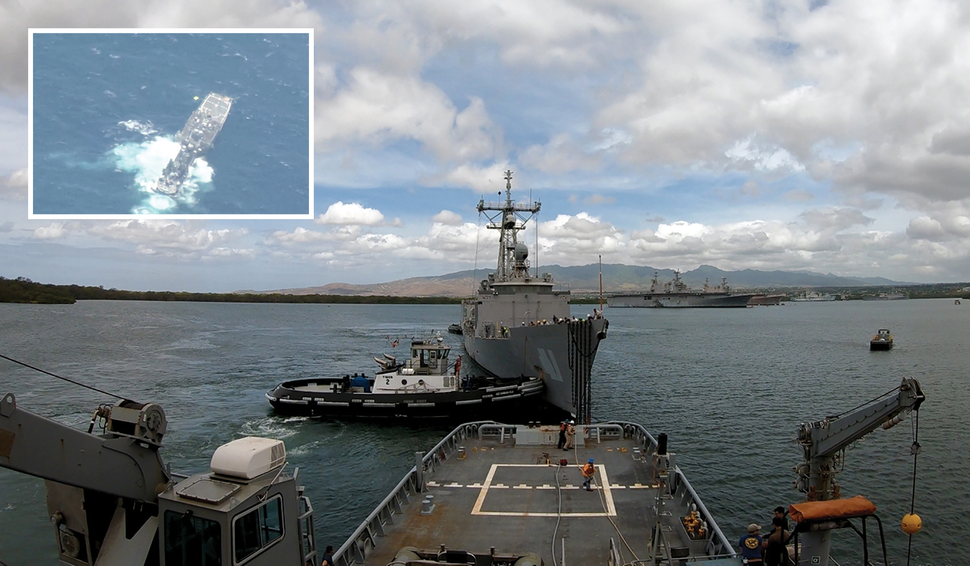 Military Sealift Command fleet ocean tug USNS Sioux (T-ATF 171) tows decommissioned frigate USS McClusky (FFG 41) out of Pearl Harbor to waters 55 miles north of Kauai, Hawaii