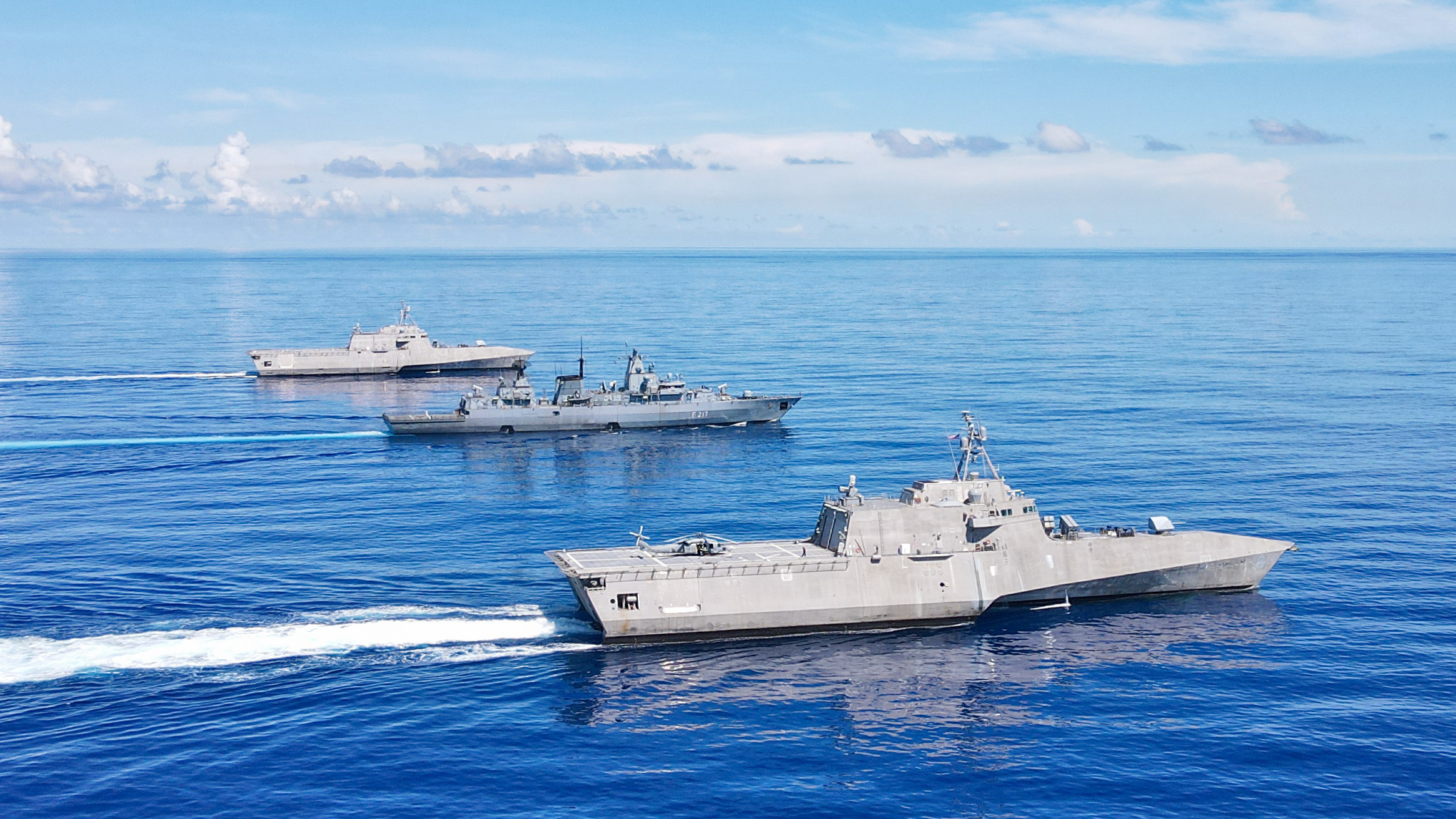 German Navy frigate Bayern with two U.S. Navy LCSs