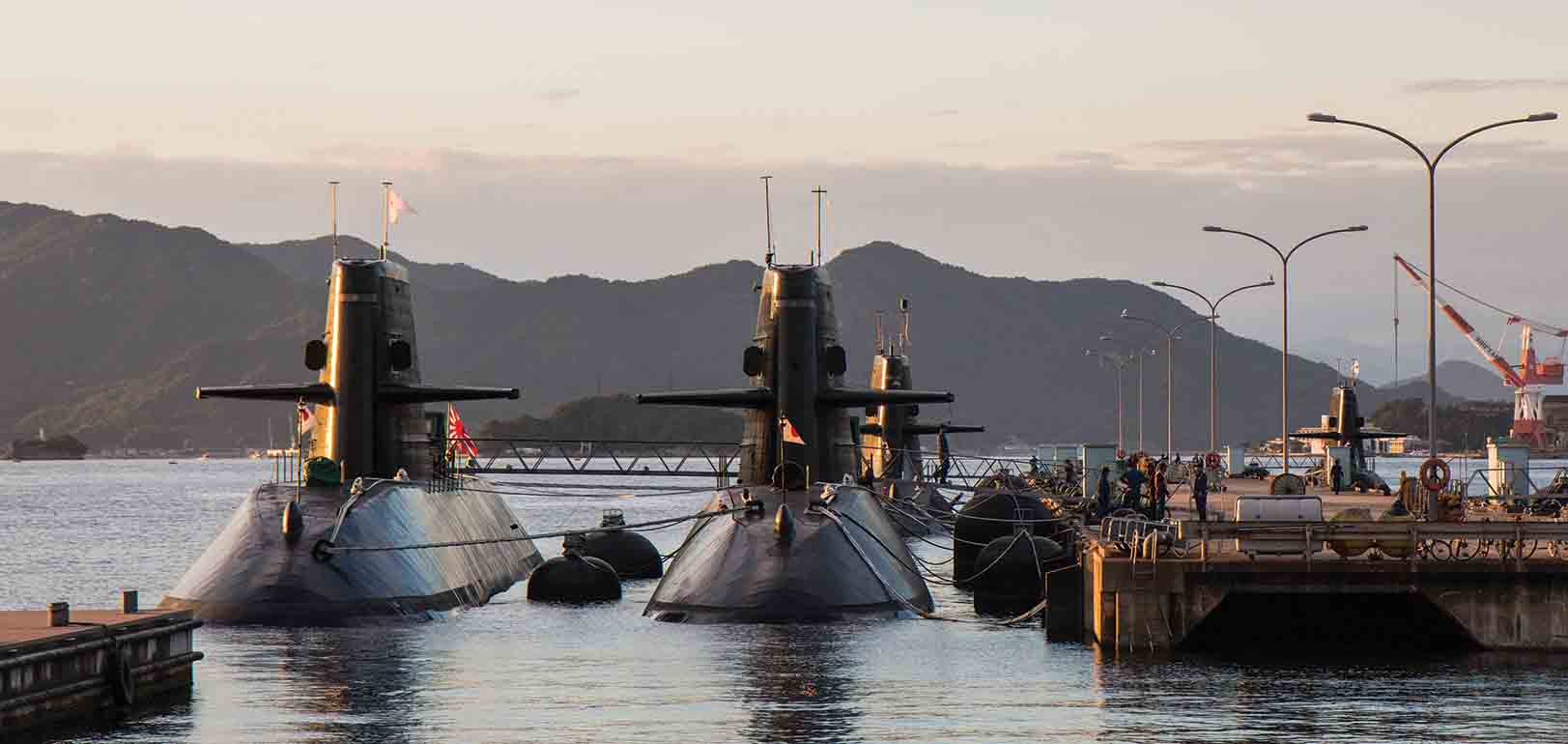 Japanese submarines docking at Kure Naval Base in Japan. Conventionally powered submarines face some operational limitations when compared to nuclear-powered units, but these could be compensated for by forward basing at allied bases such as those in Kure, Sasebo, and Yokosuka.