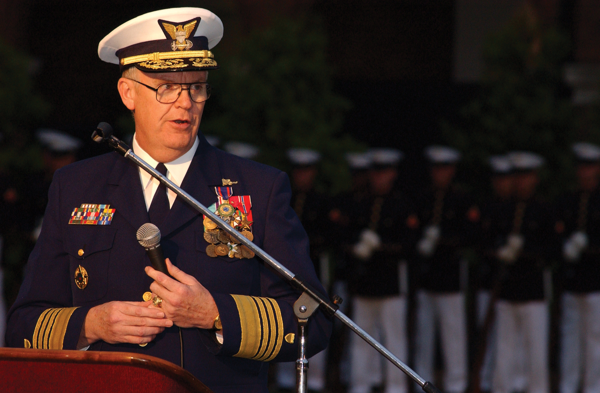 Admiral James Loy speaking at a podium