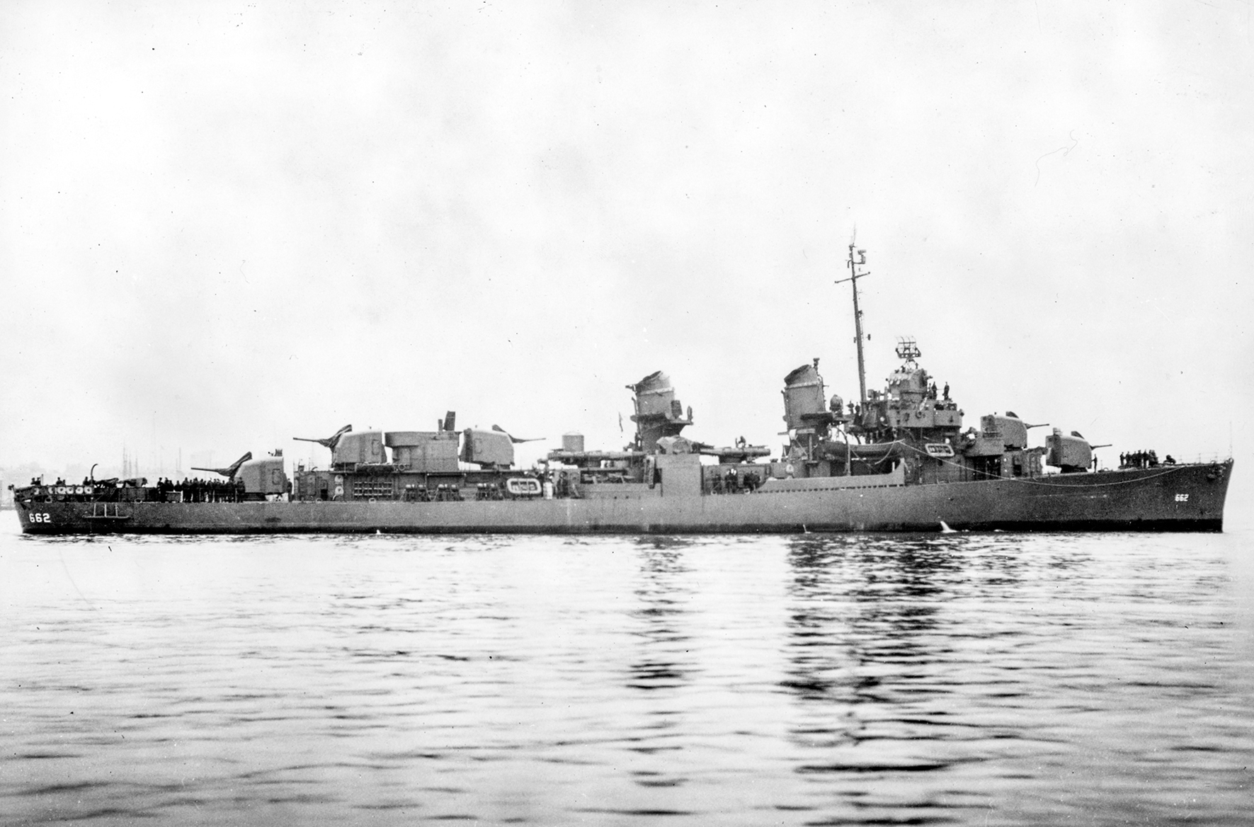 Starboard profile view of the destroyer USS Bennion (DD-662) lying off the Boston Navy Yard in 1944