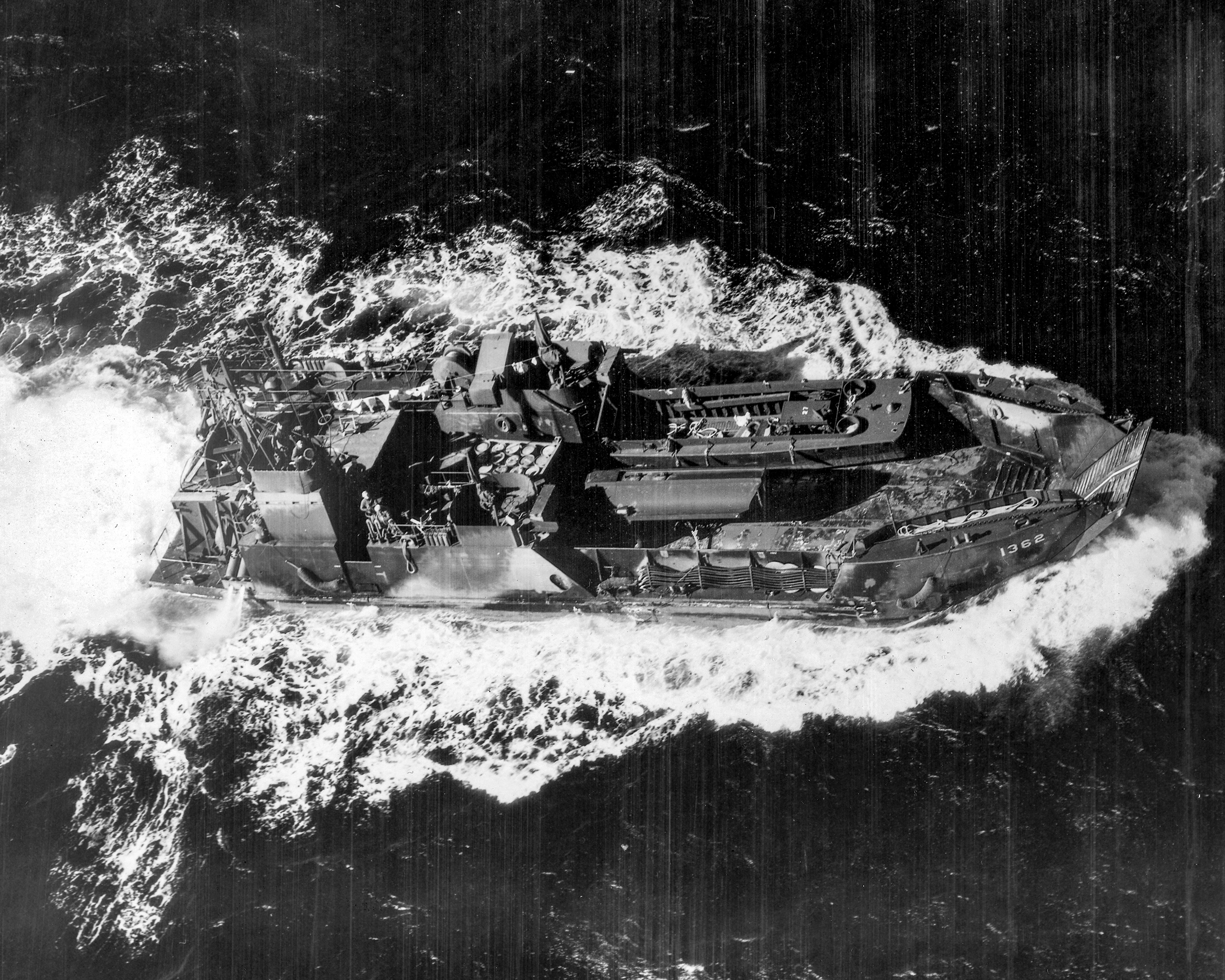 Aerial starboard side view of the camouflaged LCT(6)-1362 underway