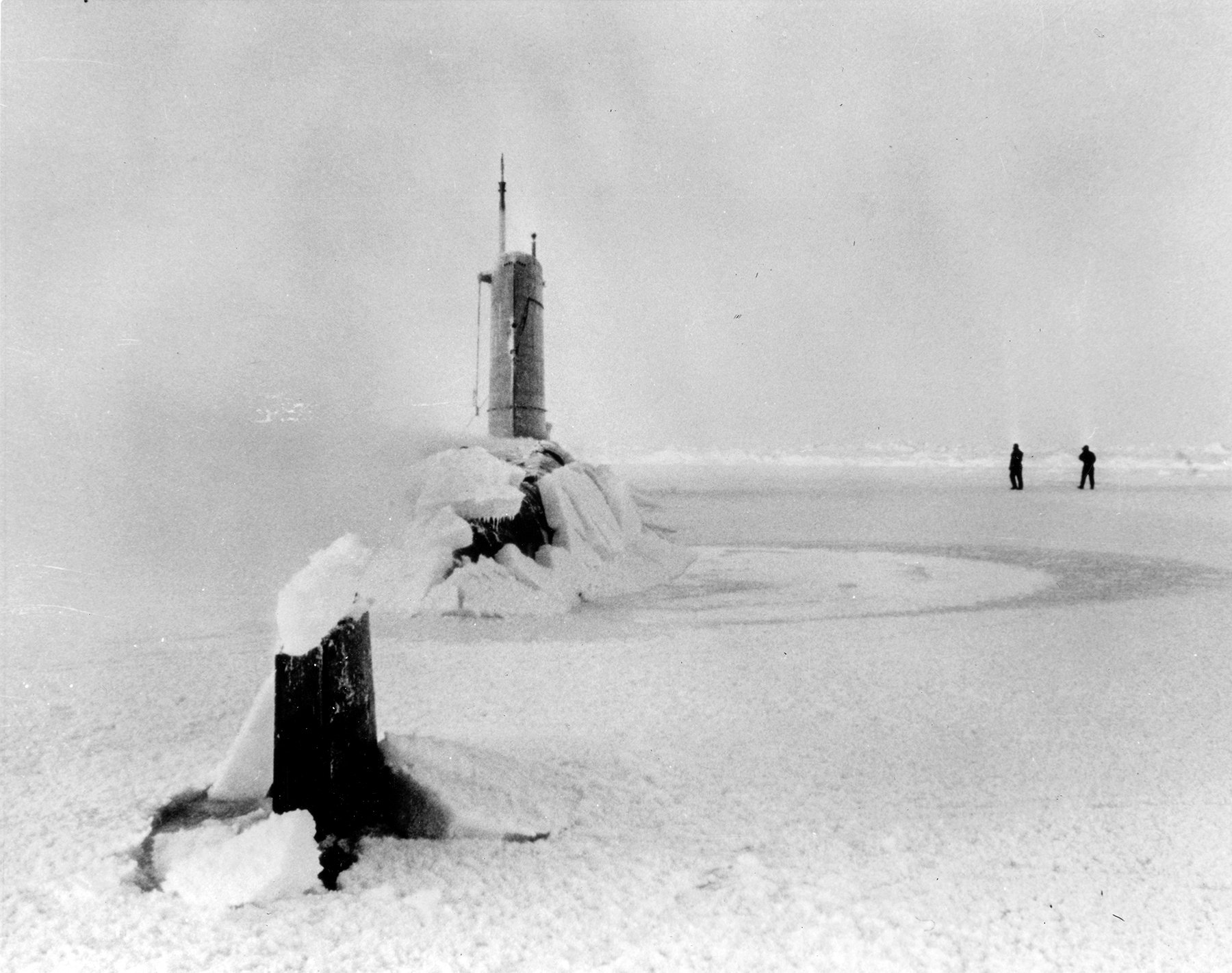 Tail view of USS Skate (SSN-578) surface through the polar ice in March 1959.