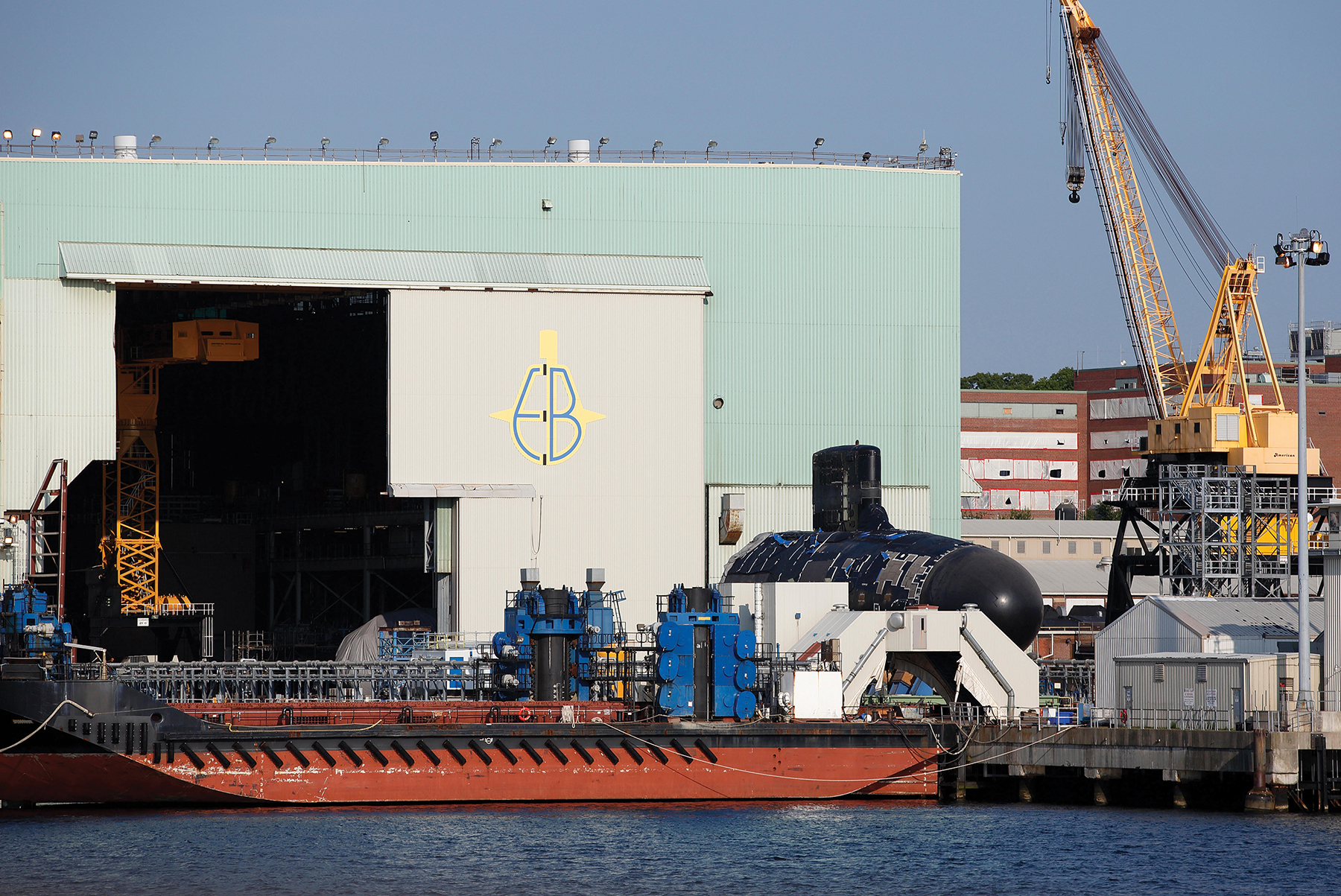 General Dynamics Electric Boat works in New London, Connecticut, where the new Columbia-class strategic ballistic missile submarine will be built by an aging workforce. Retaining expertise while one generation retires and a new generation of submarine builders develops its skills takes time and will result in some mistakes and rework, as happened already with Columbia missile-tube welds.  