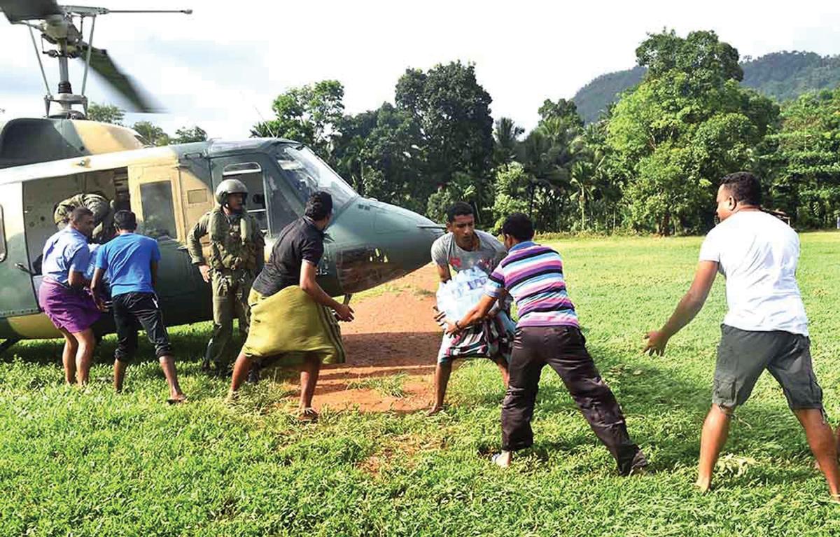    Landing zone reports collected during the 11th MEU’s phase-zero recon were used within two months, here by a Sri Lanka Air Force helicopter providing relief after floods and mudslides in May 2017. (U.S. MARINE CORPS / JAMES R. SKELTON)