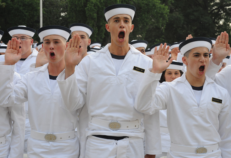 Because midshipmen come from diverse backgrounds, the plebe experience can differ from person to person. Here, the incoming class of 2019 takes the oath of office on induction day.