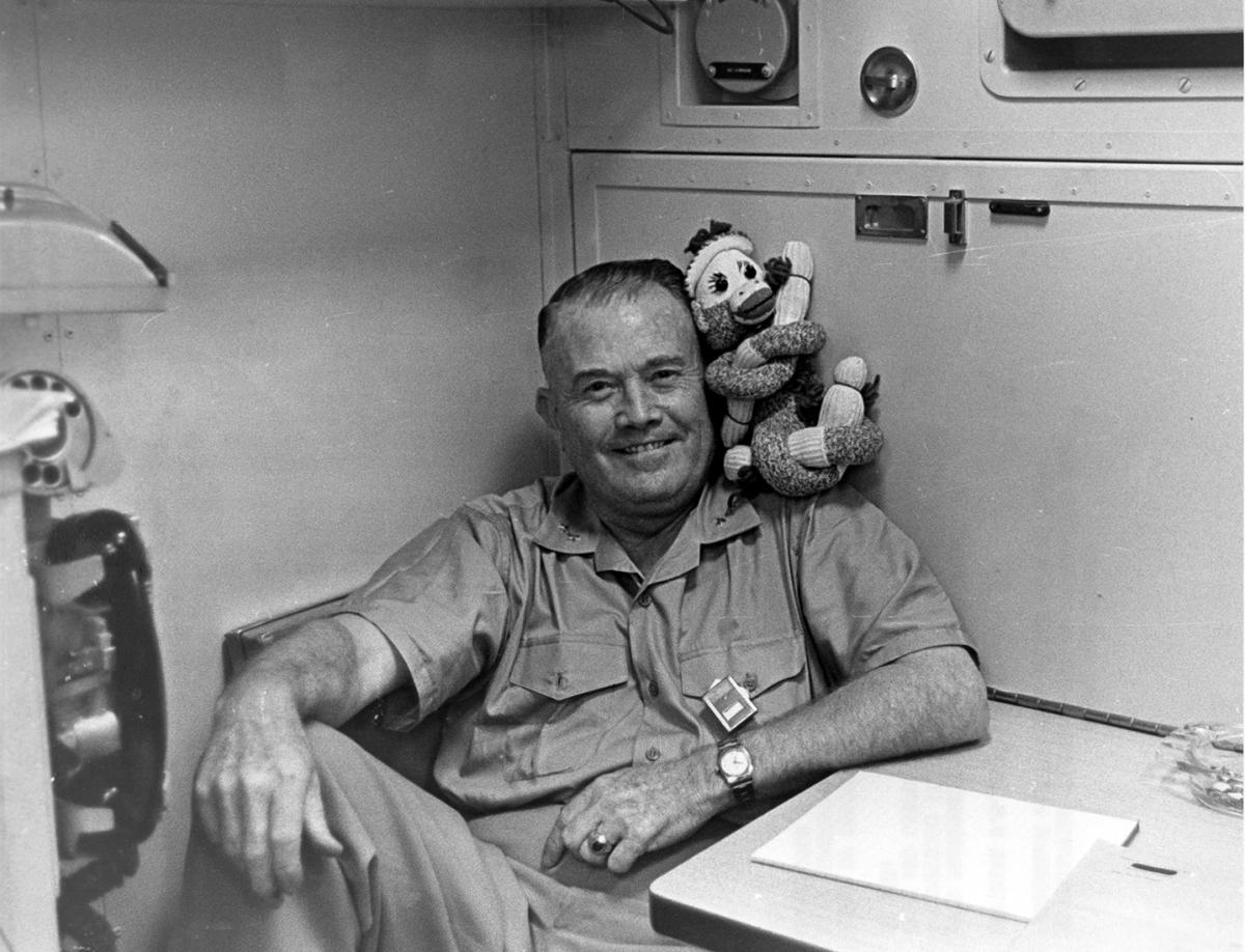 Admiral Raborn with a stuffed monkey that was an unofficial mascot of the Polaris program