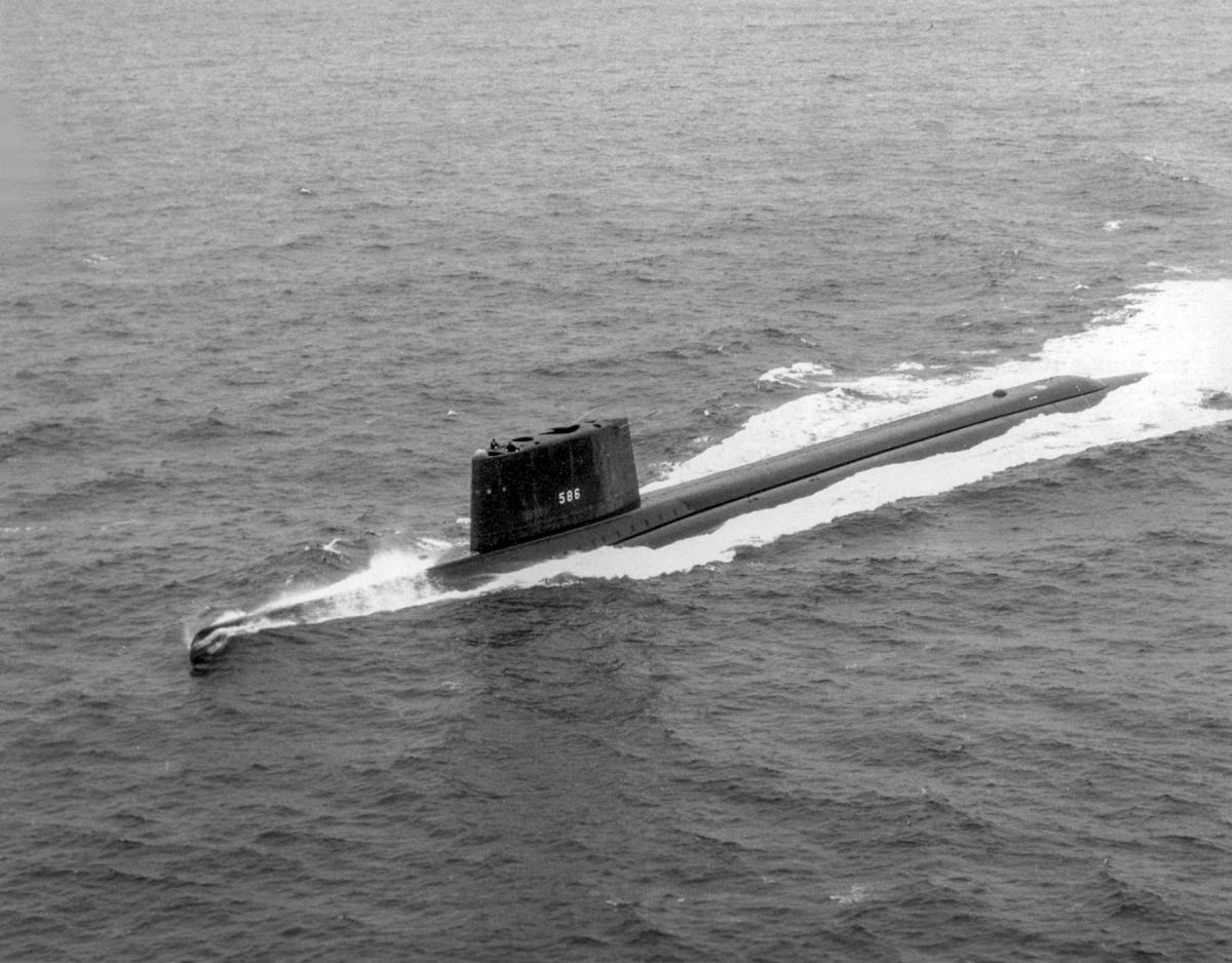 Aerial oblique port bow view of the USS Triton (SSN-586) underway