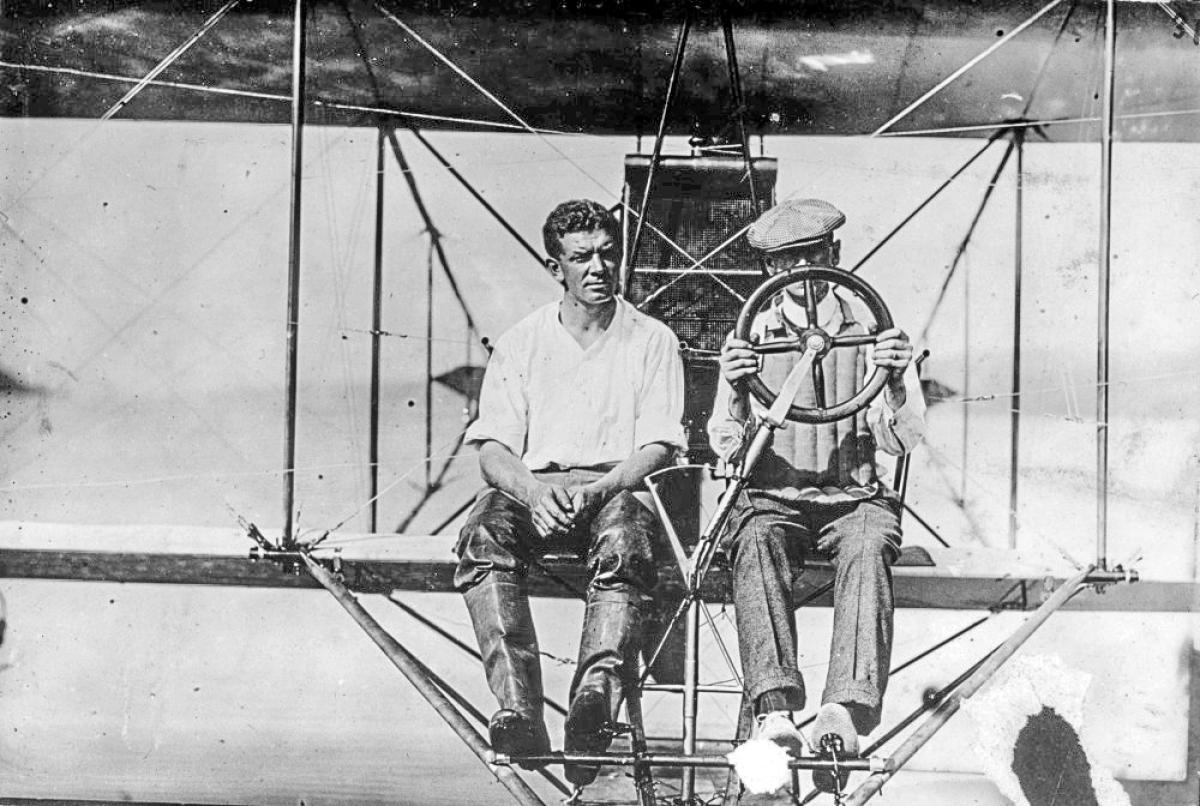 Lieutenant T. G. Ellyson, U. S. Navy, and Glenn Curtiss sitting in an aircraft