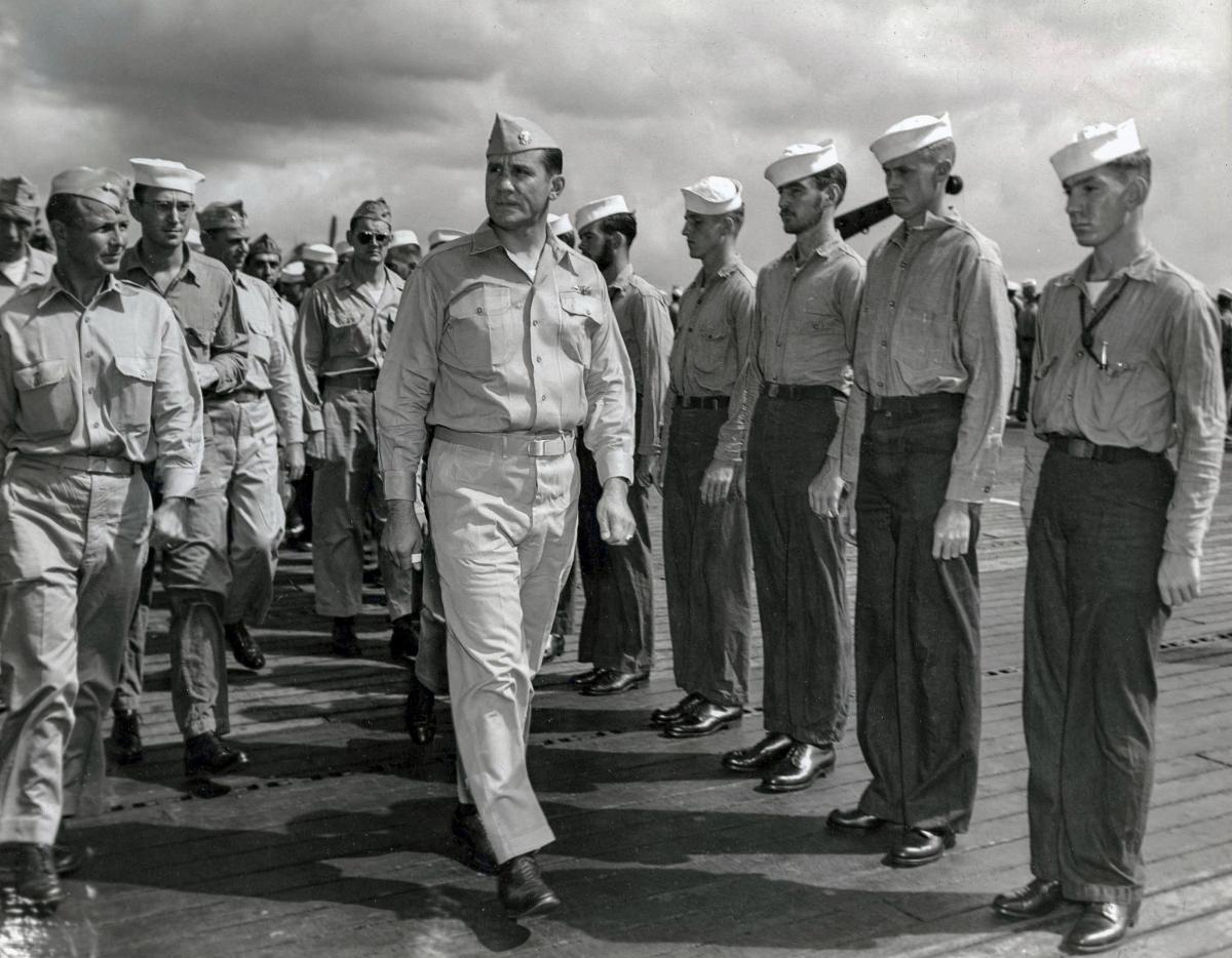 Captain Walter Vieweg makes his first personnel inspection on board the Gambier Bay