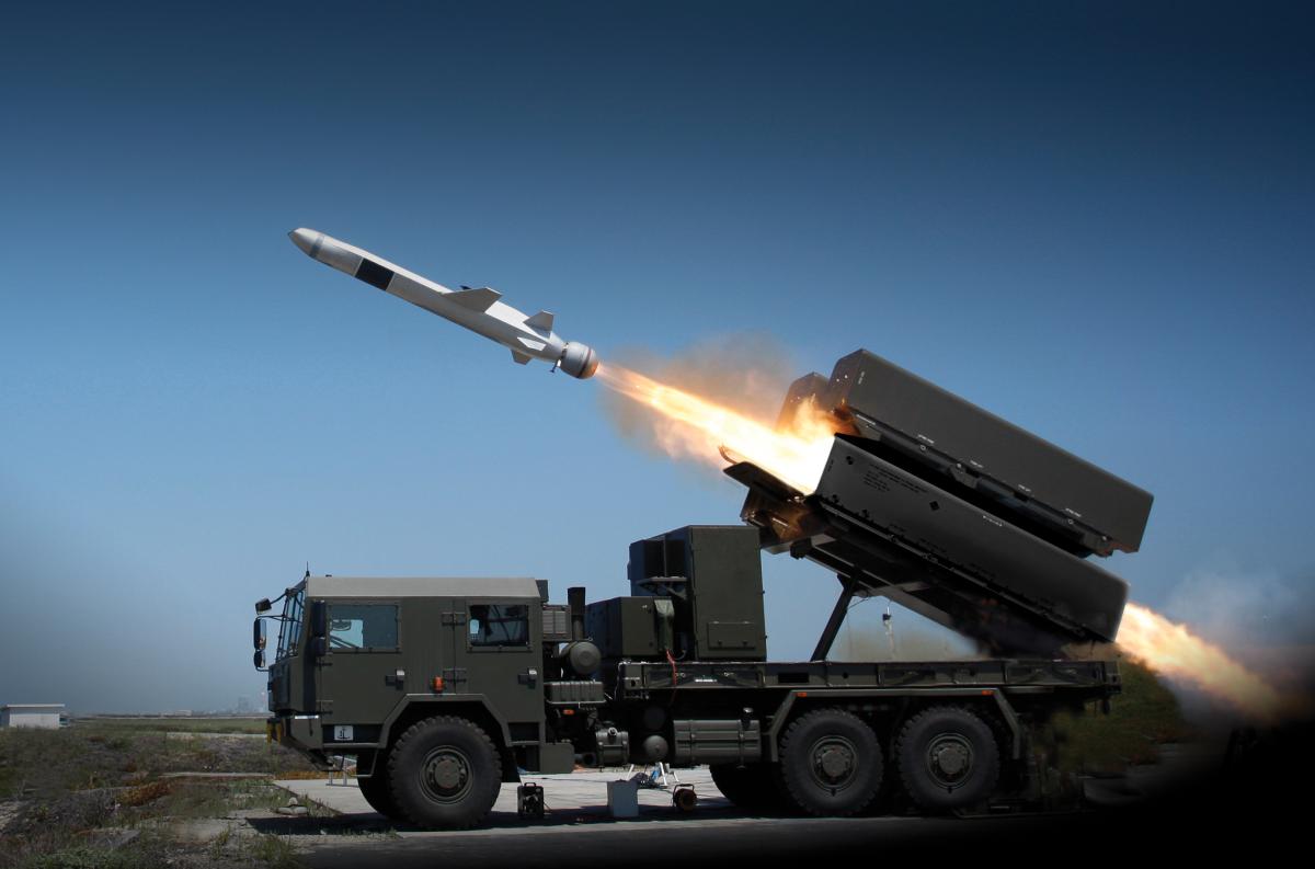 Raytheon/Kongsberg Naval Strike Missile launching from truck-mounted launcher.