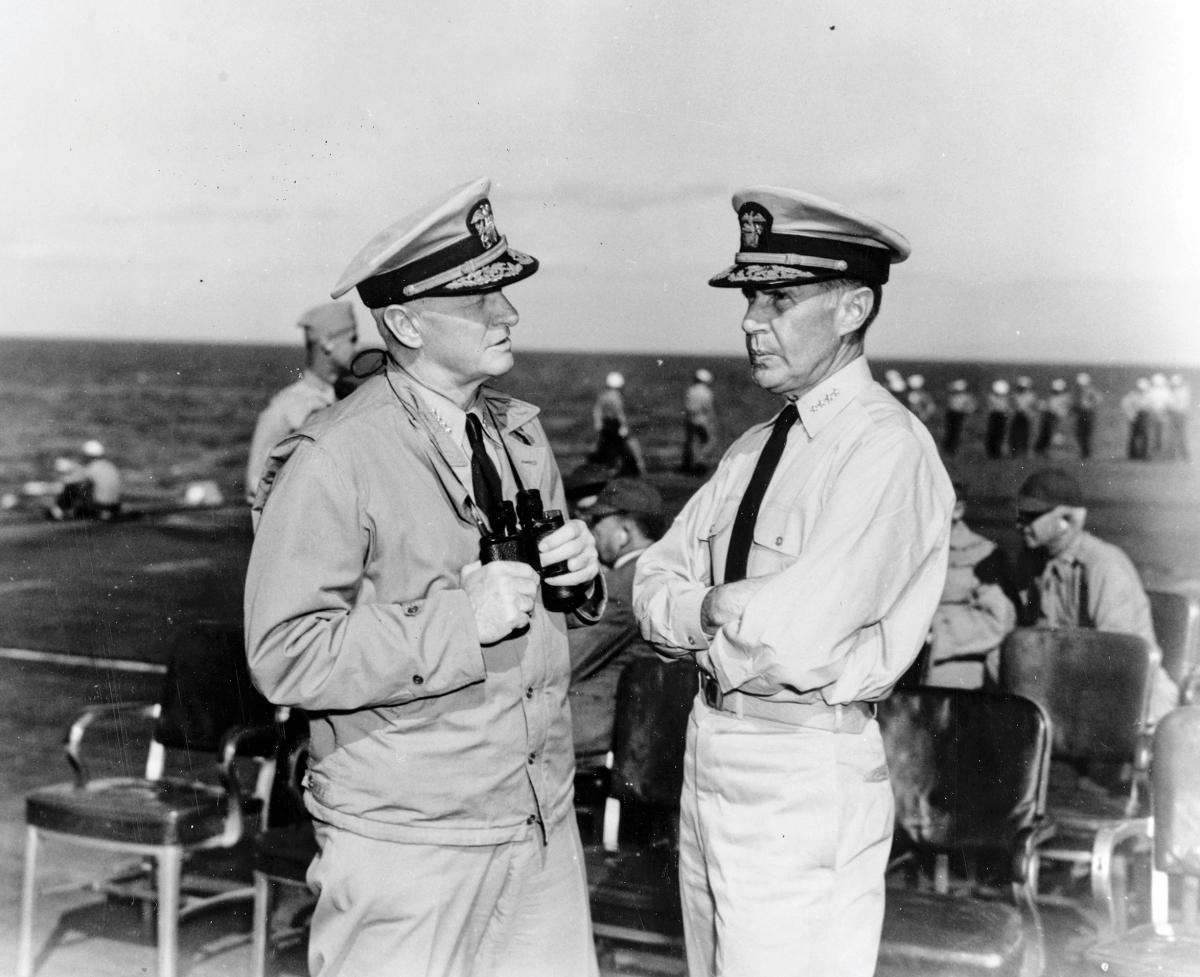 Admiral Raymond A. Spruance speaking with Admiral Chester W. Nimitz