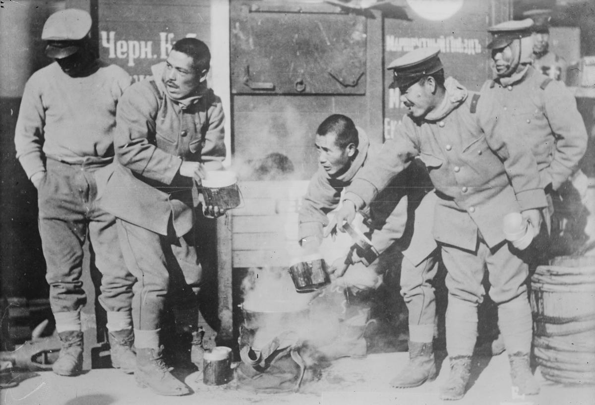 Japanese troops on occupation duty in Siberia get a hot meal.