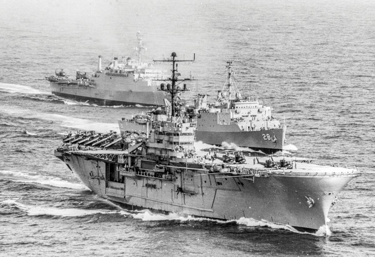 three ships of an amphibious landing group, led by the Iwo Jima (LPH-2), steam toward  their objective off South Vietnam