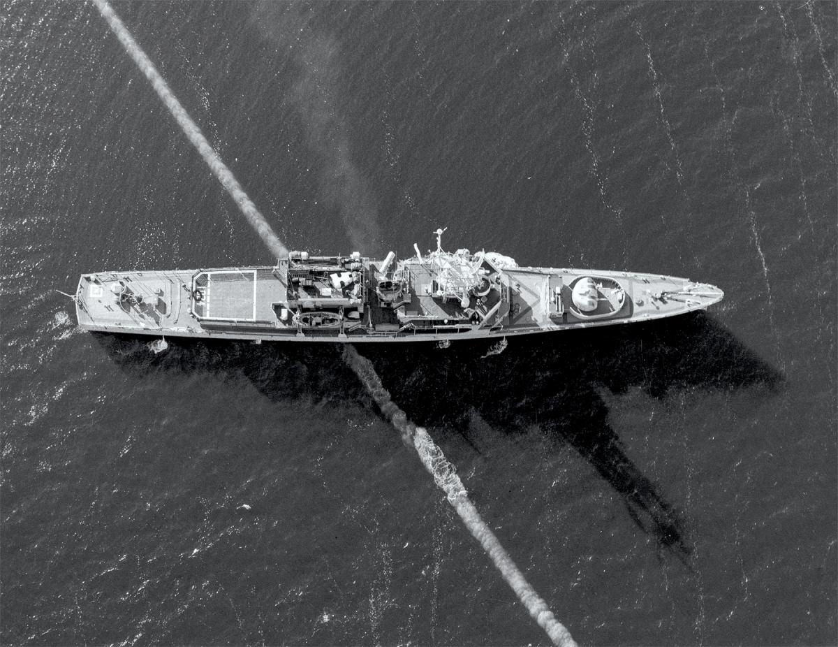 A Mk 48 torpedo passes under a U.S. Navy ship during a 1972 exercise.