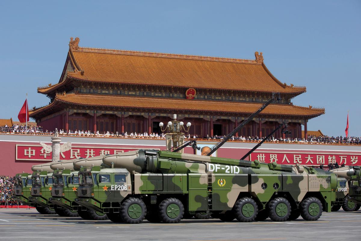 Chinese military vehicles carrying DF-21D antiship ballistic missiles past Tiananmen Gat