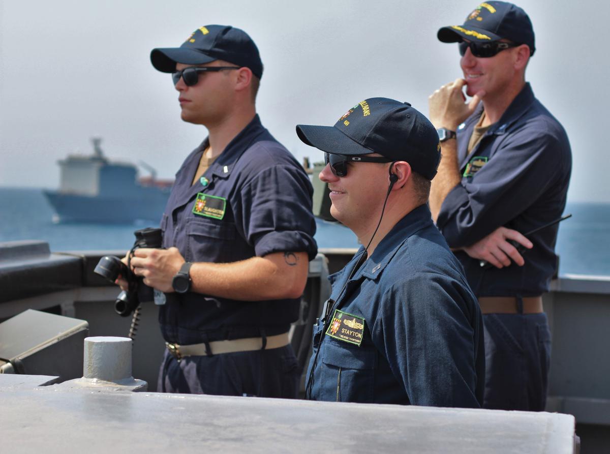 Officers standing watch on the guided-missile destroyer USS The Sullivans (DDG-68)
