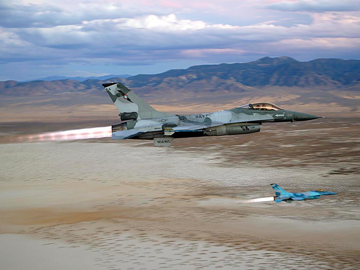 Two Navy F-16N Fighting Falcons in flight over the desert