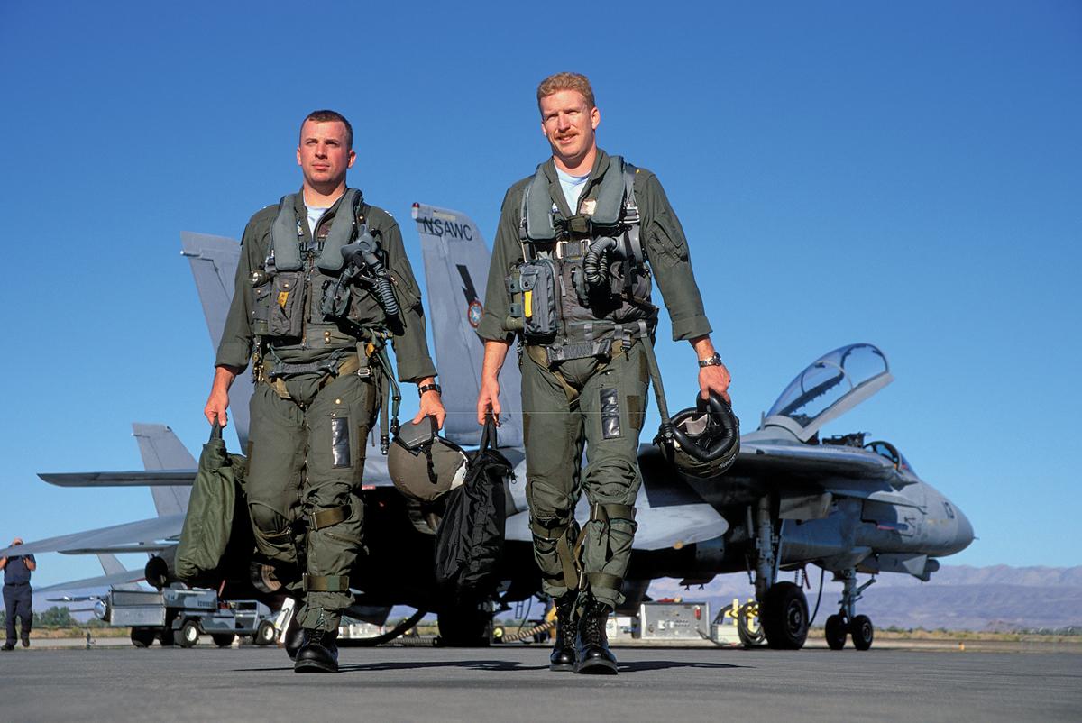 After a flight, an F-14 Tomcat crew heads to the debrief.